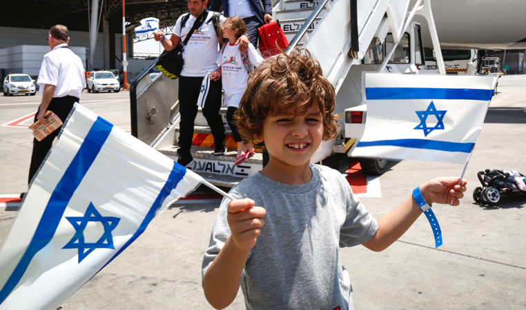 small boy with Israeli flags